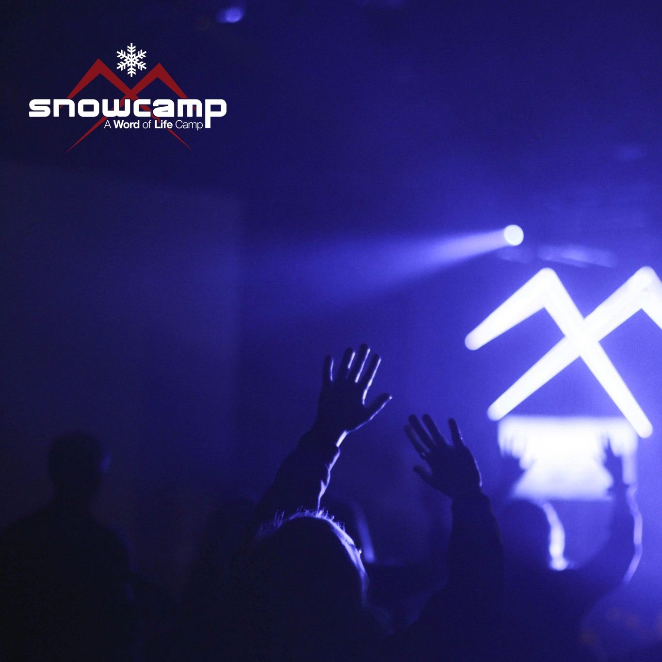 snowcamp logo with people raising their hands at a concert.