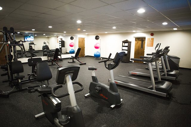 Exercise equipment in an empty room.