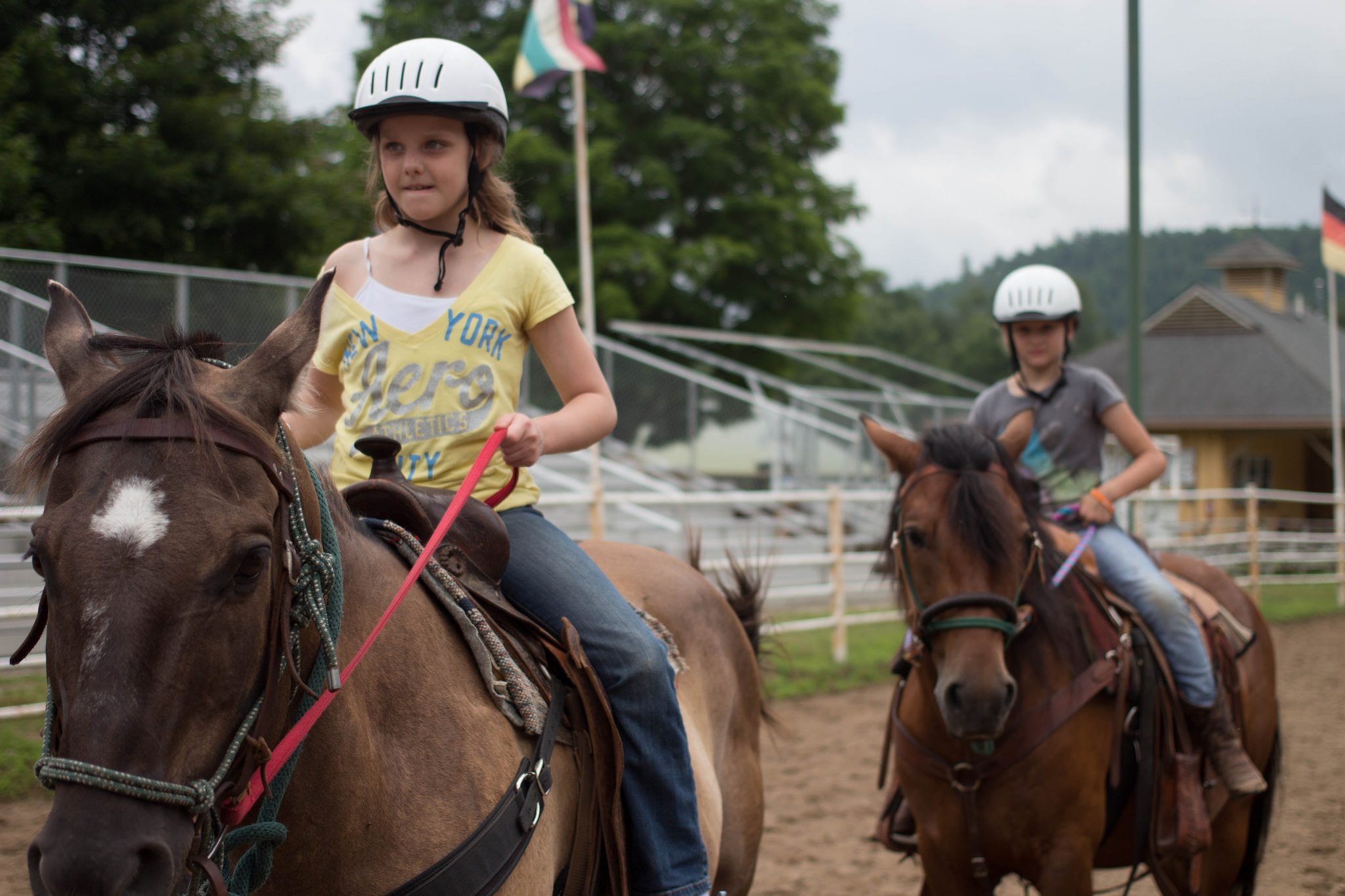 kids riding western style horses.