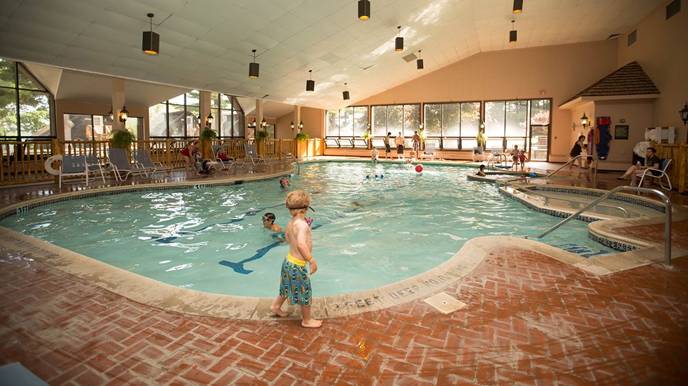 People using an indoor pool.