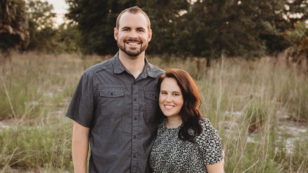 Ethan Warren and wife standing in a field
