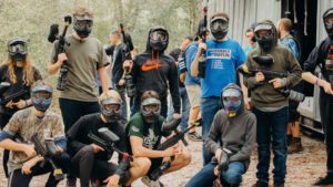 people lined up to play paintball